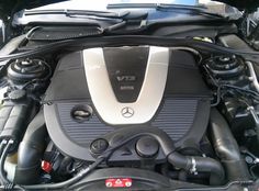 the engine compartment of a mercedes c - class sedan