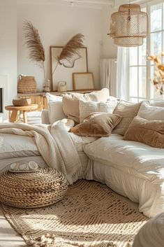 a living room filled with lots of furniture and pillows