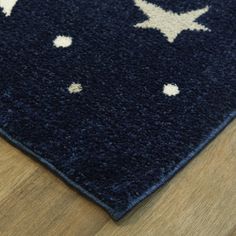 a blue rug with white stars on it