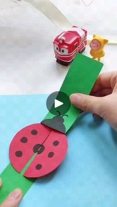 someone is making a paper lady bug craft