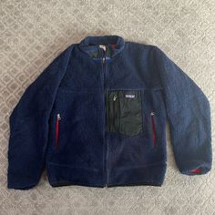 Warm And Wind Proof Vintage Patagonia Full-Zip Fleece. Men’s M. Small Signs Of Wear But Still Has A Full Life Ahead Of It. Navy Exterior And Red Interior Navy Exterior, Patagonia Retro X, Lizzy Mcalpine, Fleece Men, Outfit References, Holiday Wishlist, Coats Vintage, Vintage Patagonia, Full Life