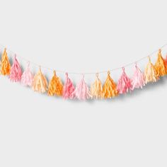 an orange, pink and yellow tasselled garland