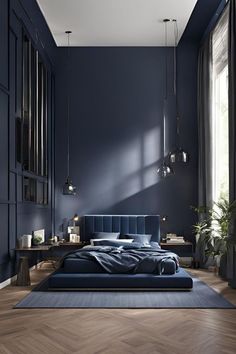 a bedroom with dark blue walls and wooden floors