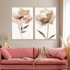 two paintings on the wall above a pink couch