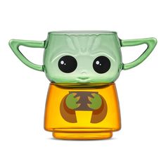 the baby yoda toy is sitting on top of a yellow cup with its eyes wide open