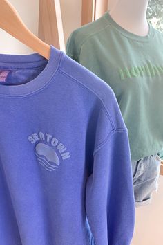 The Emerald City, Seattle, Seatown – whatever you call it, you can't help but love it! Rep your fave northwest city by rocking this inky blue sweatshirt. With the feeling of a vintage worn-in pullover, you'll be reaching for this cutie over and over again. 80% Cotton / 20% Polyester Garment dyed sweatshirt with fleecy inside and puff ink screen print. Fit note: fits true to size with a unisex fit. If between sizes, we recommend sizing up. Kelly is 5'10" and is wearing a size M. Machine wash, col Seattle Sweatshirt, The Emerald City, Dyed Sweatshirt, Comfort Colors Sweatshirt, Cold Outfits, Puff Print, Emerald City, Vintage Hoodies