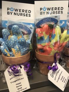 two baskets filled with stuffed animals on top of a store shelf next to each other