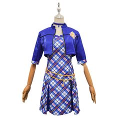 a female mannequin wearing a blue dress with plaid pattern and yellow ribbon around the waist