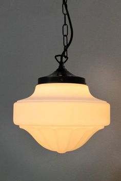 a white light hanging from a black chain