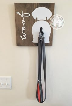 a dog leash holder is mounted on the wall