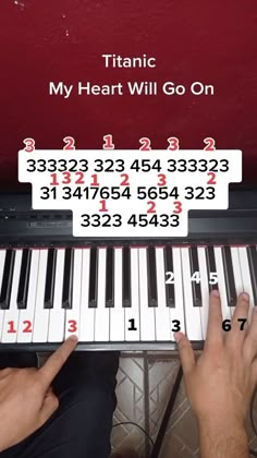 someone is playing the piano with numbers on it and their fingers are pointing at them