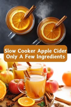 two glasses of apple cider with cinnamon sticks and orange slices on the side next to apples