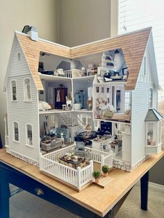 a doll house is shown on a table