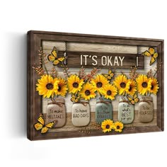 a wooden sign with sunflowers and mason jars