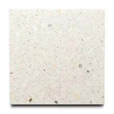 a white marble tile with small speckles on the top and bottom, against a white background