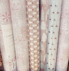 several rolls of wrapping paper sitting next to each other