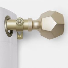 an image of a curtain rod with knobs on it