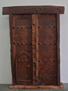 an old wooden door with intricate carvings on it