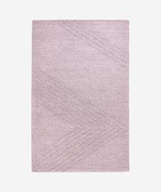 a pink rug with white lines on the side and a light purple area rug in the middle