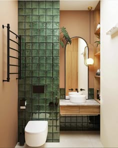 an image of a bathroom with green tiles on the walls