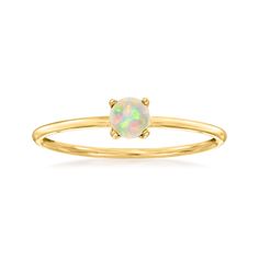 a gold ring with an opal stone