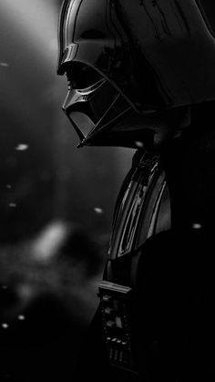 darth vader from star wars is shown in black and white, with the light shining