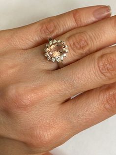 a woman's hand with a ring on it