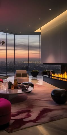 a living room with large windows and a fire place in the center, along with modern furniture