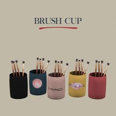 the brush cup has five brushes in it and is designed to look like they have been placed