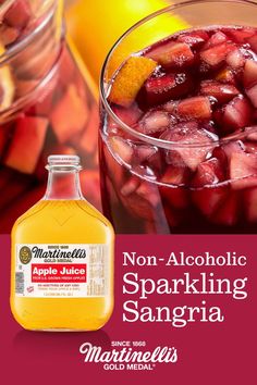 a bottle of sparkling sangria next to a glass filled with fruit