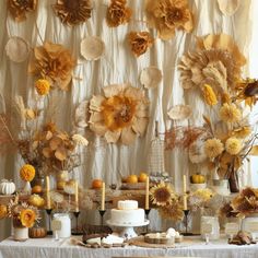 a table topped with lots of different types of cakes and desserts covered in flowers