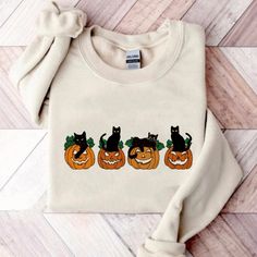 Halloween Sweatshirt, Cat Sweatshirt, Ghost Shirt, Halloween Sweater, Halloween Cat Shirt, Cat Lover Shirt, Black Cat Shirt, Spooky Season A sturdy and warm sweatshirt bound to keep you warm in the colder months. Our Gildan crewneck sweatshirts are a nice, soft and comfy midweight sweatshirt. The perfect sweatshirt for everyday wear and cozy for those cold nights. * 50% cotton, 50% polyester * Pre-shrunk * Classic fit * 1x1 athletic rib knit collar with spandex * Air-jet spun yarn with a soft fe Cute Halloween Sweaters, Halloween Clothing, Halloween Sweaters, Cat Lover Shirt, Cat Sweatshirt, Ghost Shirt, Diy Halloween