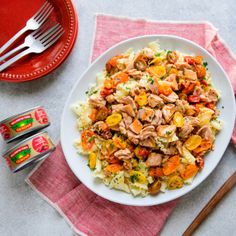 a white plate topped with pasta and chicken