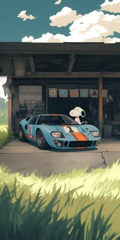 a blue sports car parked in front of a garage with an animal on it's side