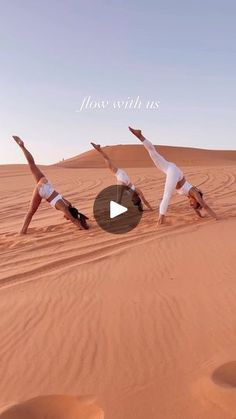 three women are doing yoga in the desert