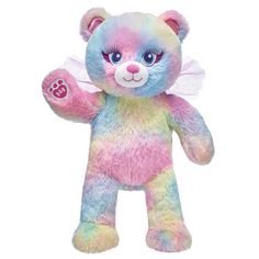 a rainbow colored teddy bear with wings