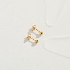 Introducing our Little Stud Earrings, a charming addition to your jewelry collection. These dainty earrings feature a classic design crafted with care. With their versatile style and understated charm, they're perfect for everyday wear. When you're not wearing this piece, tuck it away in your very own Milou jewellery box provided. Stainless Steel, plated with 18K Gold Waterproof (Tarnish Resistant) Natural Linen Milou Jewellery Box Included FREE WORLDWIDE SHIPPING Dainty Single Cartilage Earring, Tiny Minimalist Drop Cartilage Earrings, Minimalist Yellow Gold Drop Plug Earrings, Minimalist Single Plug Earring As Gift, Tiny Classic Cartilage Earrings For Everyday, Classic Tiny Cartilage Earrings For Everyday Wear, Minimalist Earrings As Gift For Her, Minimalist Round Earrings As Gift For Her, Minimalist Round Earrings For Her