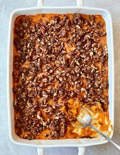 a casserole dish filled with meat and cheese