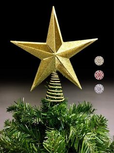 a gold star on top of a christmas tree