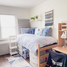 a bedroom with a bed, desk and shelves