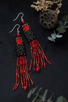 Hand embroidered flower earings.  Embroidery with cotton and viscose threads, Japanese and Czech beads, eco-suede back, large coral beads, rhodium-plated brass hardware Deep dark green background--as the depth of the forest, bright red flowers--as the fern blossom,  golden reflection of the sun--it gives me a summer solstice holiday vibe. SIZE: 9*1.5 cm | 3.5*0.5 inches (embroidered part-- 3.5*1.5 cm | 1.3*0.5 inches)   Beautiful packed and can become a great gift. If you want to make any change Beaded Fairy, Hand Embroidered Flower, Textile Earrings, Fairy Earrings, Embroidered Earrings, Dark Green Background, Earrings Beaded, Summer Solstice, Coral Beads