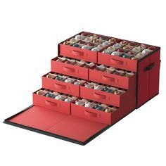 the red drawers are filled with many different items and have compartments for each item to store