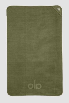 an olive green blanket with the word alo printed on it