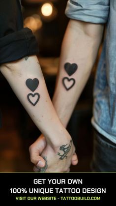 two people holding hands with hearts tattooed on their arms and the words get your own 100 % unique tattoo design