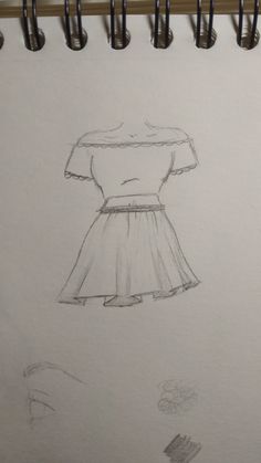 a drawing of a dress is shown on a piece of paper