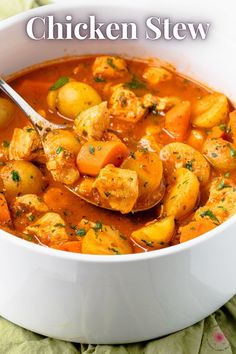 a white bowl filled with stew and potatoes