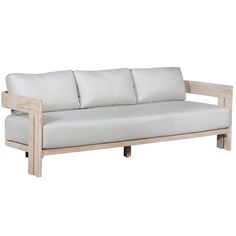 a white couch sitting on top of a wooden frame