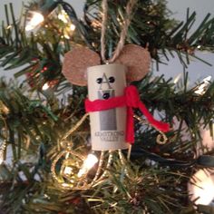 a christmas ornament hanging from the top of a tree