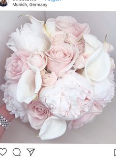 a bridal bouquet with pink roses and white callas is displayed on an instagram page