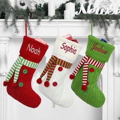 three christmas stockings hanging from a mantel